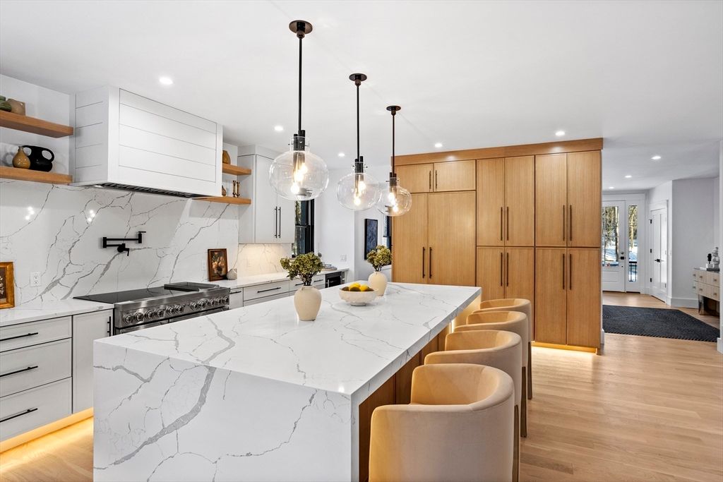 Interior, Kitchen, Marble Walls, Pendant Lights, Recessed Lighting, Stainless Steel Appliances, Wood Texture Flooring