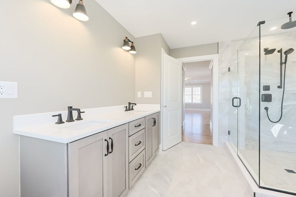 Bathroom, Dual Sink Vanities, Glass Shower, Interior, Marble, Marble Walls, Recessed Lighting