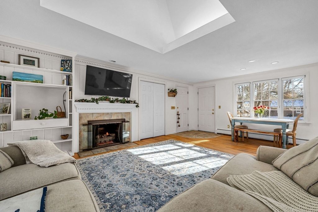 Dining room, Fireplace, Interior, Living room, Recessed Lighting, Wood Texture Flooring