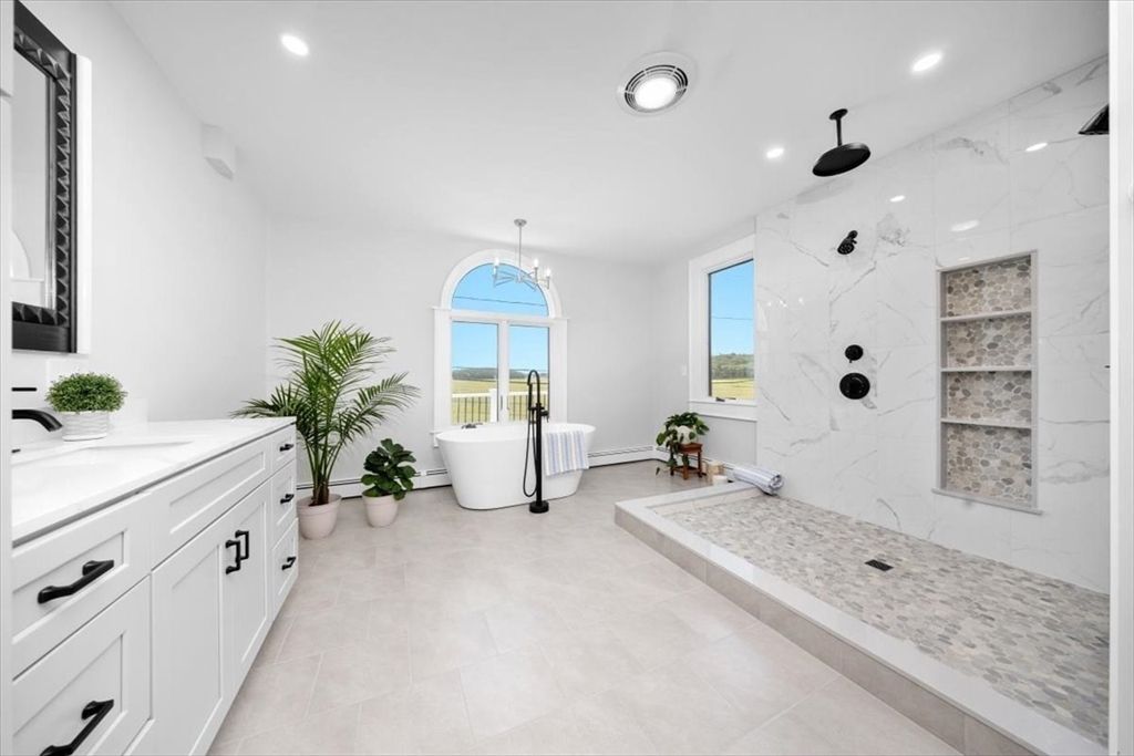 Bathroom, Chandelier, Dual Sink Vanities, Free Standing Baths, Glass Shower, Interior, Marble Walls, Recessed Lighting