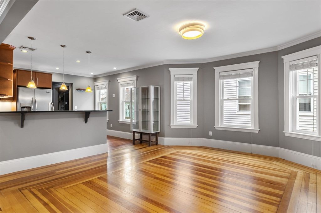 Empty room, Interior, Kitchen, Pendant Lights, Recessed Lighting, Stainless Steel Appliances, Wood Texture Flooring