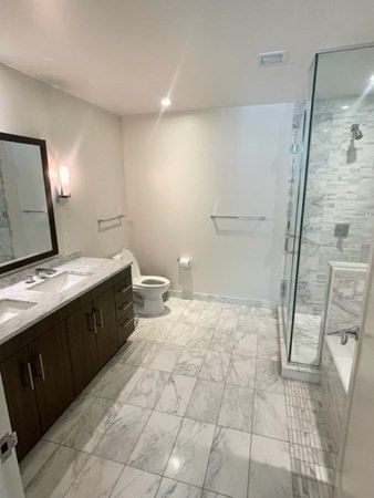 Bathroom, Dual Sink Vanities, Glass Shower, Interior, Marble, Marble Walls, Recessed Lighting