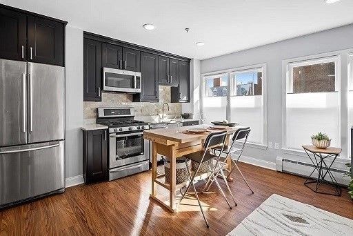 Dining room, Interior, Kitchen, Recessed Lighting, Stainless Steel Appliances, Wood Texture Flooring