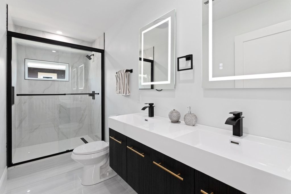 Bathroom, Dual Sink Vanities, Glass Shower, Interior, Marble Walls, Recessed Lighting, Wood Texture Flooring
