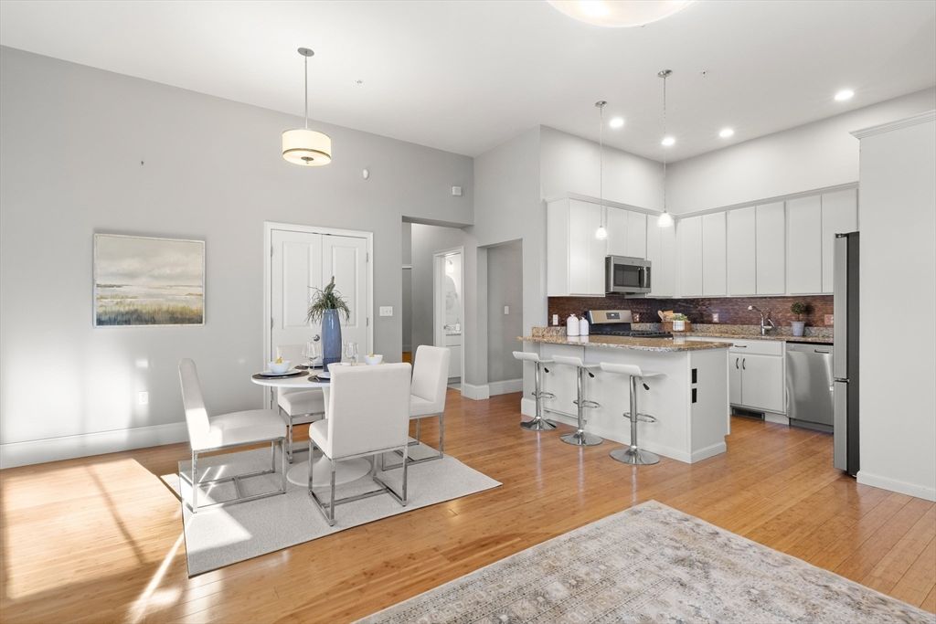 Dining room, Interior, Kitchen, Pendant Lights, Recessed Lighting, Stainless Steel Appliances, Wood Texture Flooring