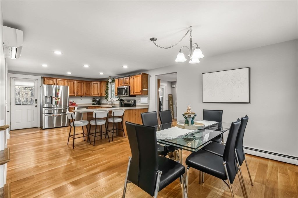 Dining room, Interior, Kitchen, Pendant Lights, Recessed Lighting, Stainless Steel Appliances, Wood Texture Flooring