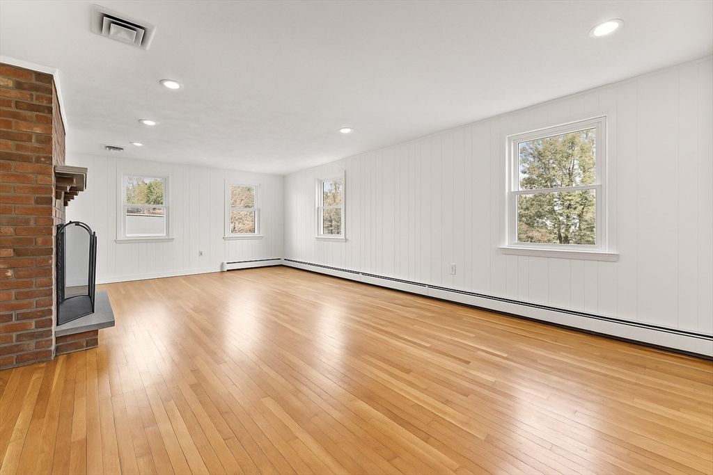 Empty room, Fireplace, Interior, Recessed Lighting, Stone Walls, Wood Texture Flooring
