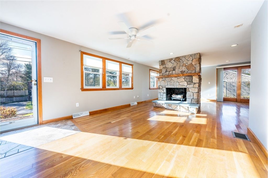 Empty room, Fireplace, Interior, Recessed Lighting, Stone Walls, Wood Texture Flooring