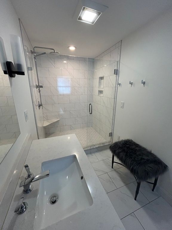 Bathroom, Dual Sink Vanities, Glass Shower, Interior, Marble Walls, Recessed Lighting