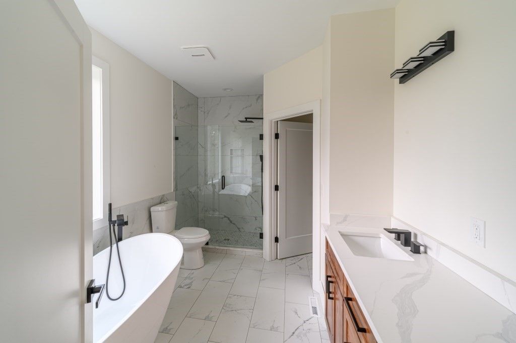 Bathroom, Dual Sink Vanities, Glass Shower, Interior, Marble, Marble Walls, Recessed Lighting