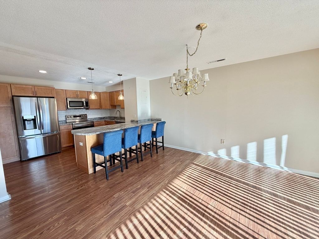 Chandelier, Interior, Kitchen, Pendant Lights, Recessed Lighting, Stainless Steel Appliances, Wood Texture Flooring