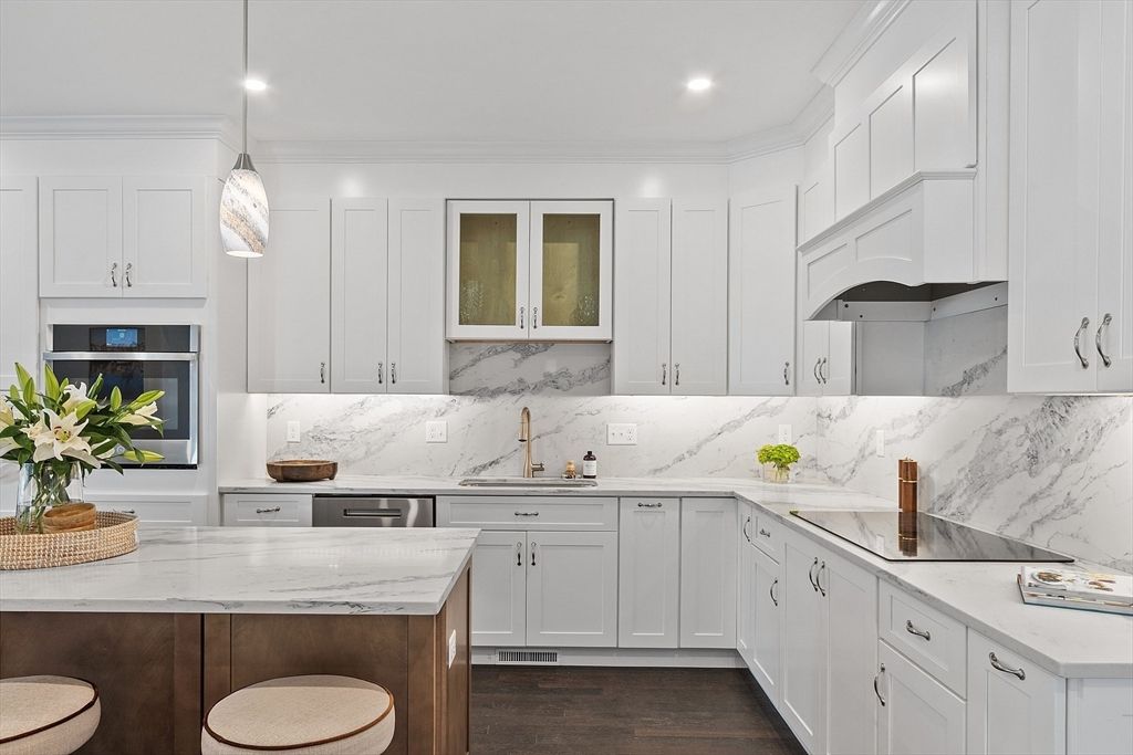 Interior, Kitchen, Marble Walls, Pendant Lights, Recessed Lighting, Stainless Steel Appliances, Wood Texture Flooring