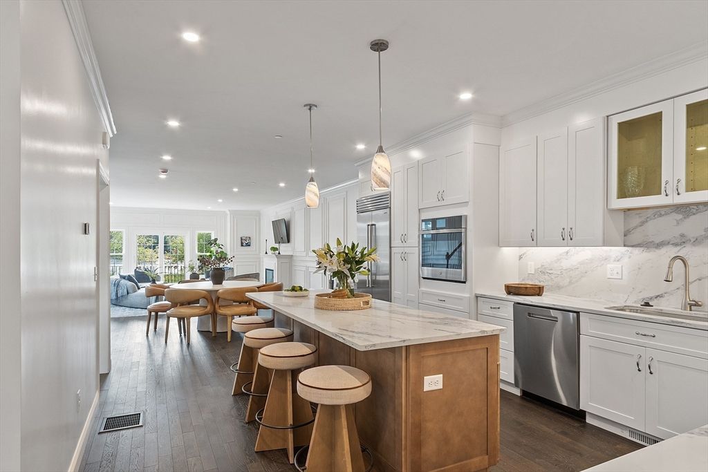 Dining room, Interior, Kitchen, Pendant Lights, Recessed Lighting, Stainless Steel Appliances, Wood Texture Flooring