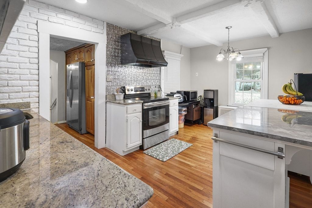 Interior, Kitchen, Pendant Lights, Recessed Lighting, Stainless Steel Appliances, Stone Walls, Wood Texture Flooring