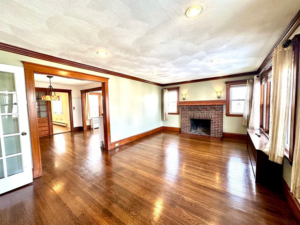 Chandelier, Empty room, Fireplace, Interior, Recessed Lighting, Wood Texture Flooring