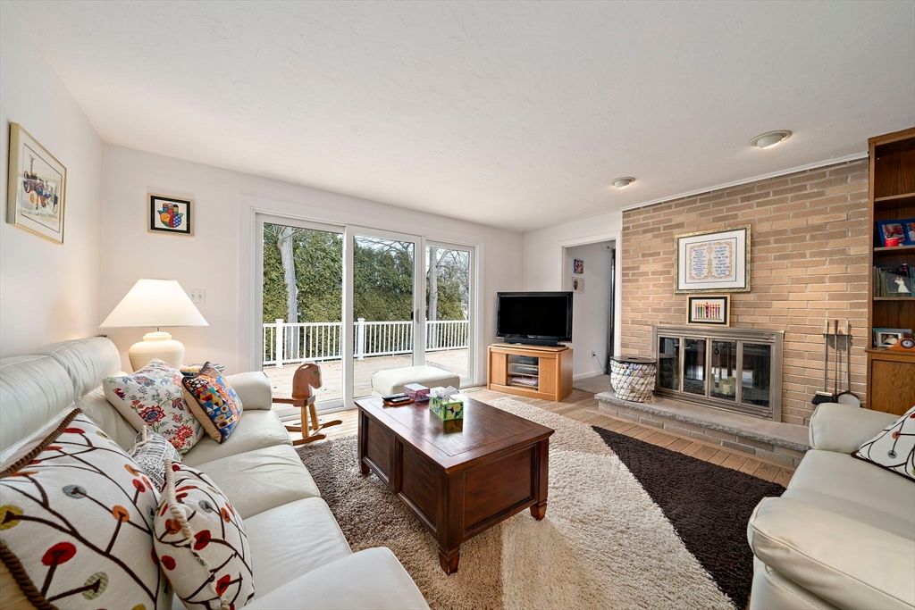 Fireplace, Interior, Living room, Recessed Lighting, Stone Walls, Wood Texture Flooring