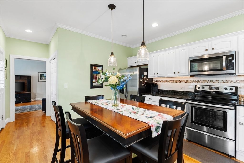 Dining room, Interior, Kitchen, Pendant Lights, Recessed Lighting, Stainless Steel Appliances, Wood Texture Flooring