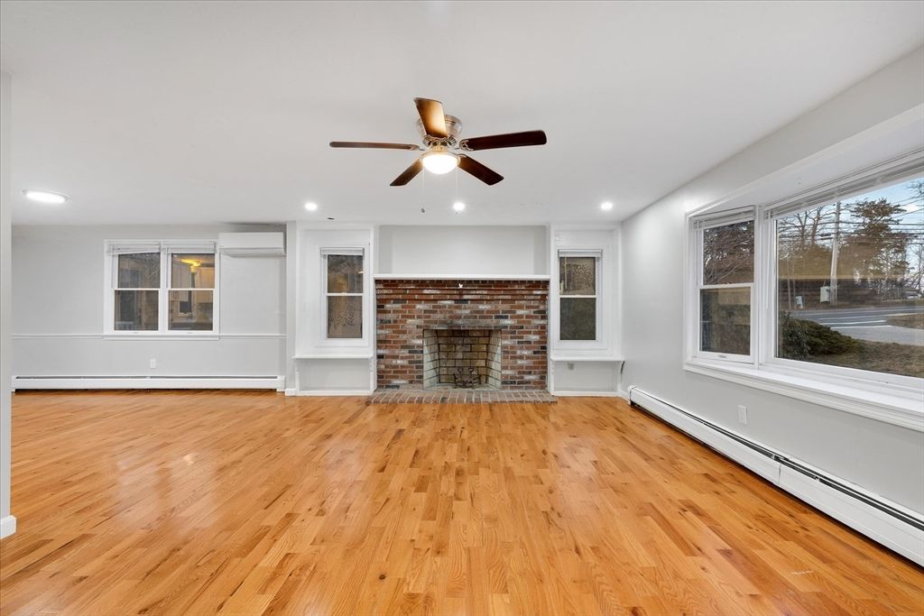 Empty room, Fireplace, Interior, Recessed Lighting, Stone Walls, Wood Texture Flooring