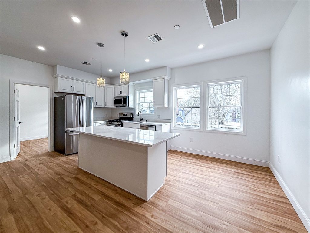 Interior, Kitchen, Pendant Lights, Recessed Lighting, Stainless Steel Appliances, Wood Texture Flooring