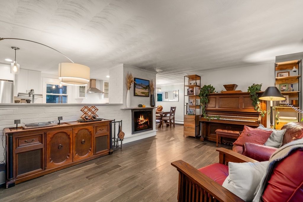 Dining room, Fireplace, Interior, Kitchen, Living room, Pendant Lights, Piano, Stainless Steel Appliances, Wood Texture Flooring