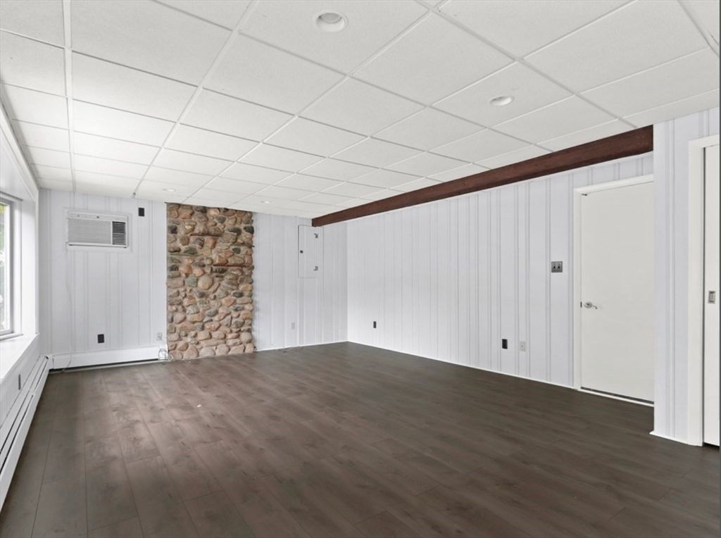 Empty room, Fireplace, Interior, Recessed Lighting, Stone Walls, Wooden Beams, Wood Texture Flooring