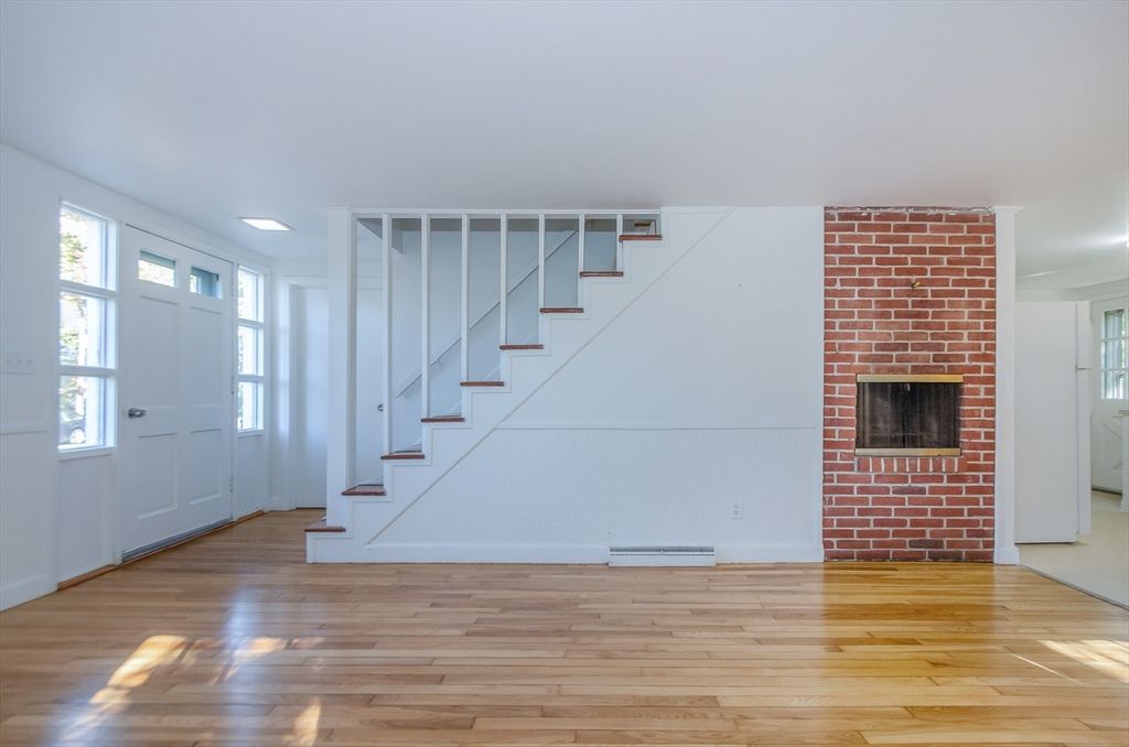 Empty room, Fireplace, Interior, Recessed Lighting, Stone Walls, Wood Texture Flooring