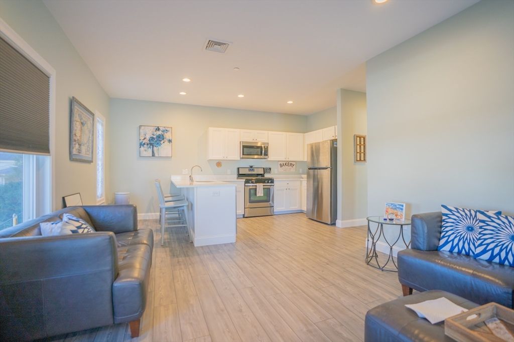 Dining room, Interior, Kitchen, Living room, Recessed Lighting, Stainless Steel Appliances, Wood Texture Flooring