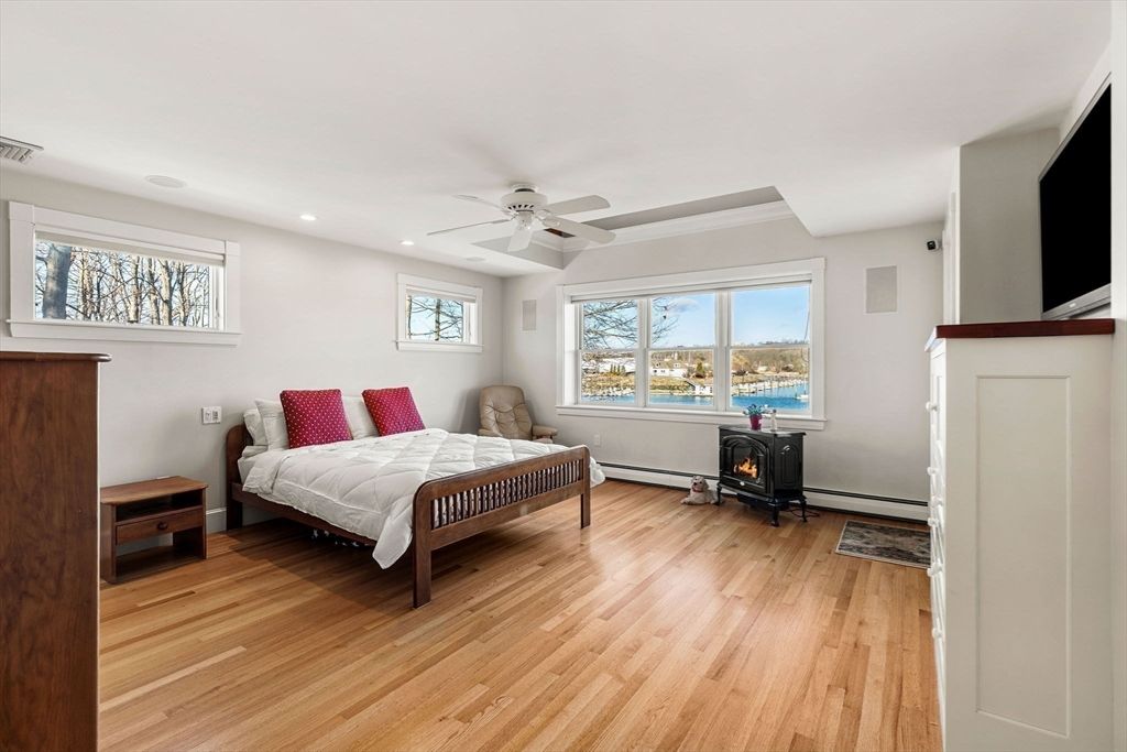 Bedroom, Fireplace, Interior, Recessed Lighting, Water, Wood Texture Flooring