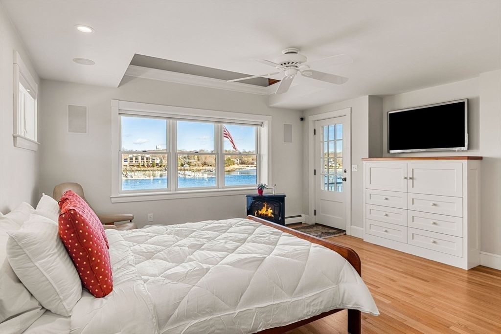 Bedroom, Fireplace, Interior, Recessed Lighting, Water, Wood Texture Flooring