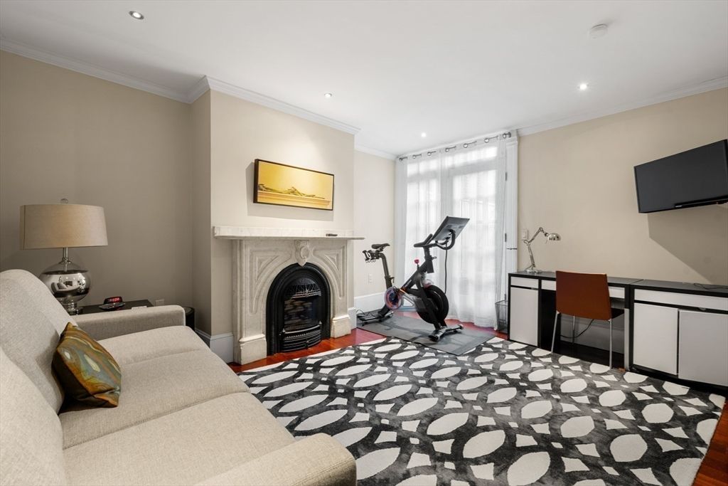 Fireplace, Fitness Equipment, Interior, Recessed Lighting, Wood Texture Flooring