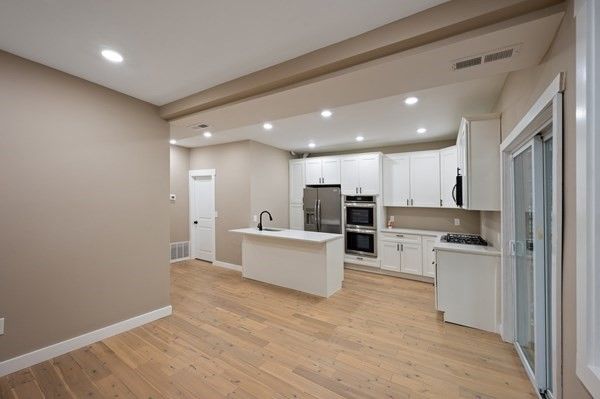 Interior, Kitchen, Recessed Lighting, Stainless Steel Appliances, Wood Texture Flooring