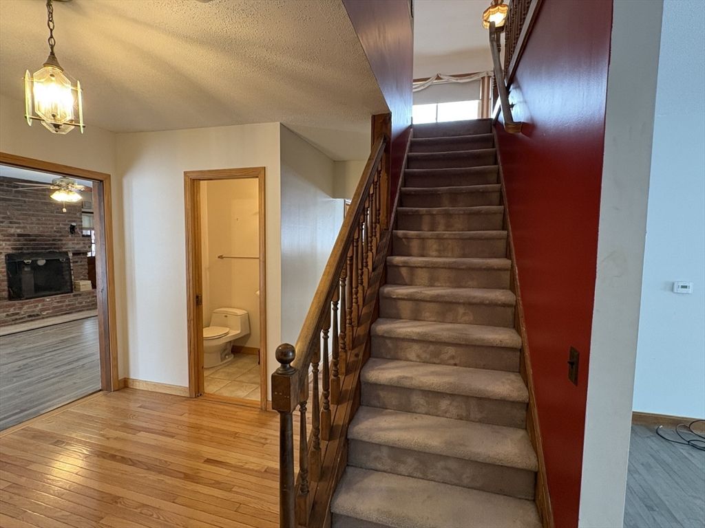Bathroom, Fireplace, Interior, Pendant Lights, Stone Walls, Wood Texture Flooring