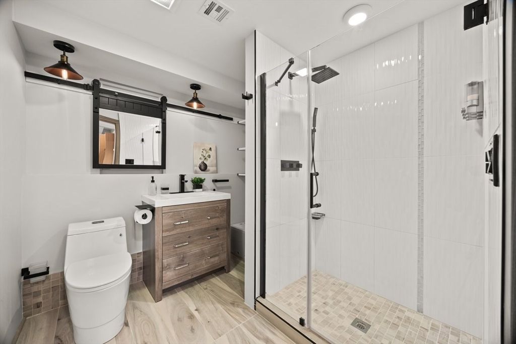 Bathroom, Dual Sink Vanities, Glass Shower, Interior, Recessed Lighting, Wood Texture Flooring