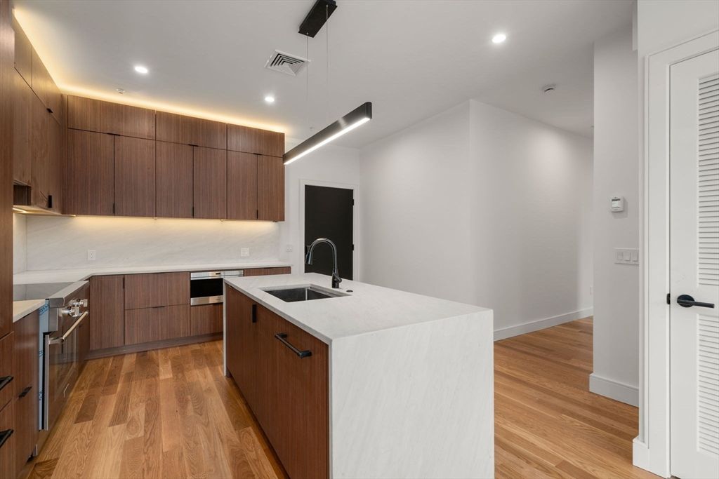 Interior, Kitchen, Pendant Lights, Recessed Lighting, Stainless Steel Appliances, Wood Texture Flooring