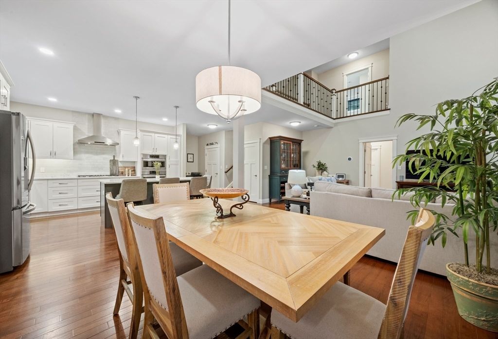 Chandelier, Dining room, Interior, Kitchen, Living room, Pendant Lights, Recessed Lighting, Stainless Steel Appliances, Wood Texture Flooring