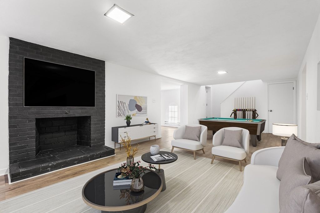 Billiard Table, Fireplace, Game Room, Interior, Living room, Recessed Lighting, Stone Walls, Wood Texture Flooring