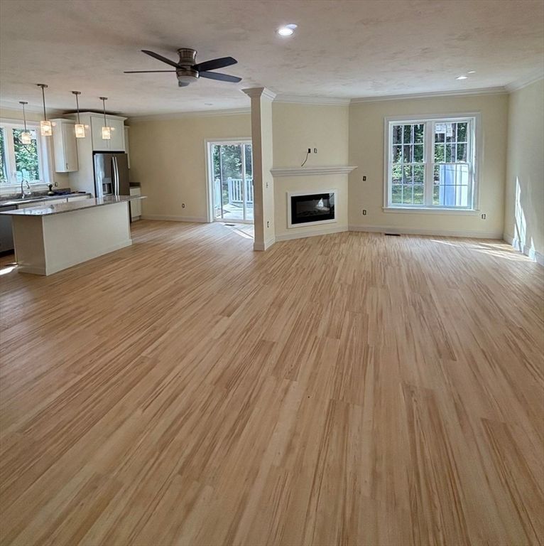 Empty room, Fireplace, Interior, Kitchen, Pendant Lights, Recessed Lighting, Wood Texture Flooring