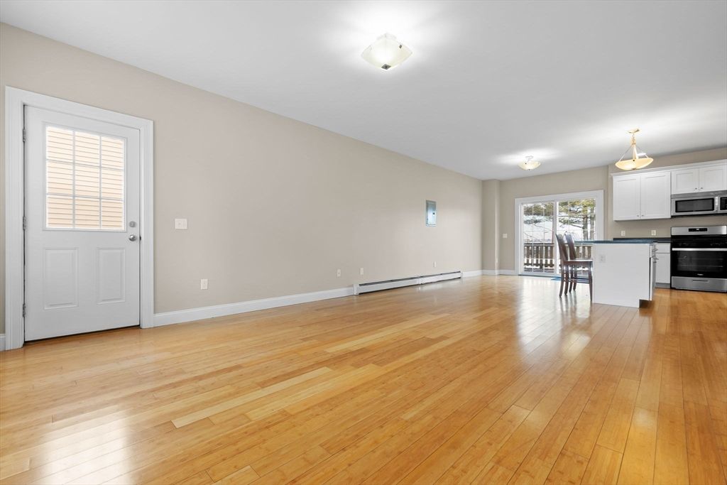 Empty room, Interior, Kitchen, Stainless Steel Appliances, Wood Texture Flooring