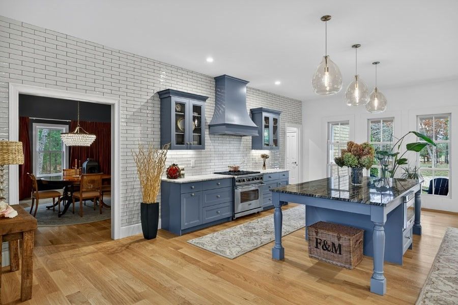 Dining room, Interior, Kitchen, Pendant Lights, Recessed Lighting, Stainless Steel Appliances, Stone Walls, Wood Texture Flooring