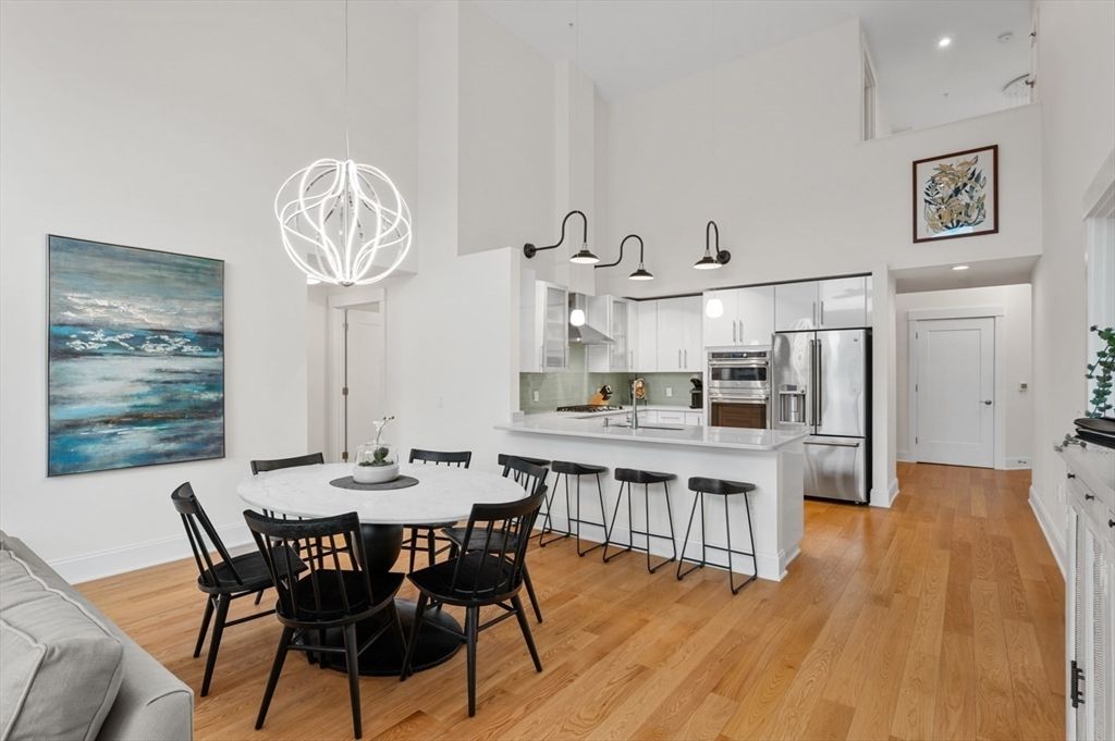 Dining room, Interior, Kitchen, Pendant Lights, Recessed Lighting, Stainless Steel Appliances, Wood Texture Flooring