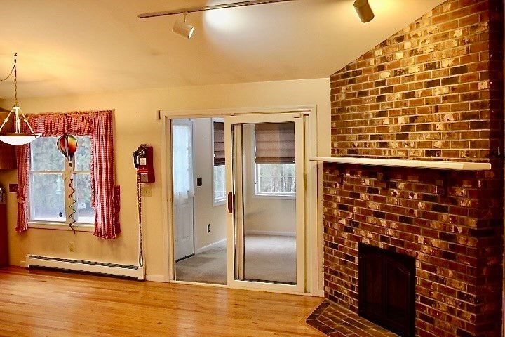 Empty room, Fireplace, Interior, Pendant Lights, Stone Walls, Wood Texture Flooring