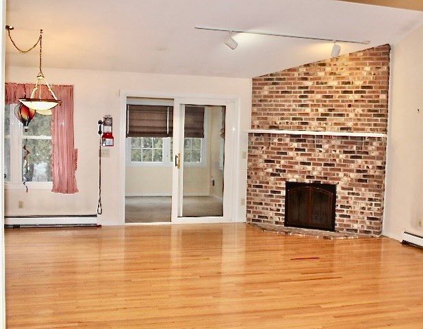 Empty room, Fireplace, Interior, Pendant Lights, Stone Walls, Wood Texture Flooring