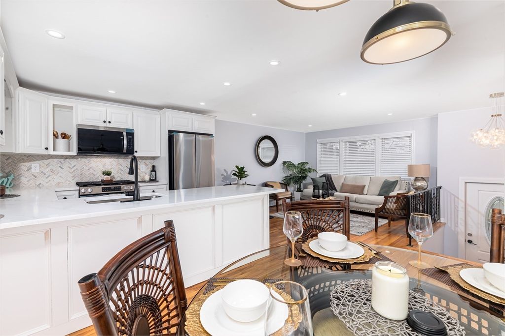 Dining room, Interior, Kitchen, Living room, Recessed Lighting, Stainless Steel Appliances, Wood Texture Flooring