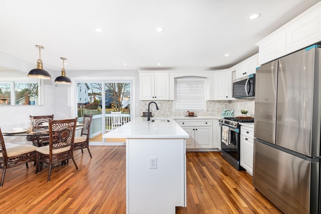 Dining room, Interior, Kitchen, Pendant Lights, Recessed Lighting, Stainless Steel Appliances, Wood Texture Flooring