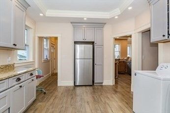 Interior, Kitchen, Recessed Lighting, Washer, Wood Texture Flooring