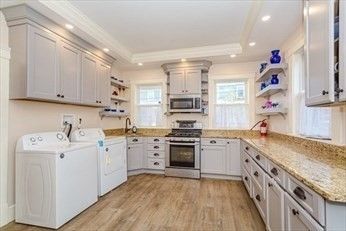 Interior, Kitchen, Recessed Lighting, Stainless Steel Appliances, Washer, Wood Texture Flooring