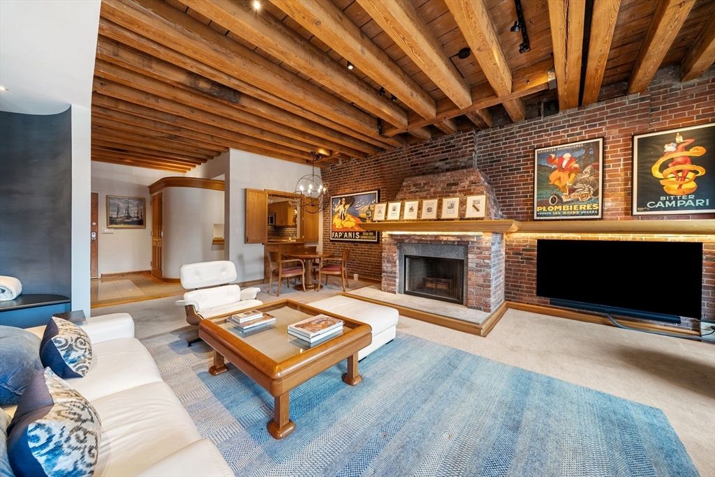 Chandelier, Dining room, Fireplace, Interior, Living room, Pendant Lights, Recessed Lighting, Stone Walls, Wooden Beams, Wooden Ceilings