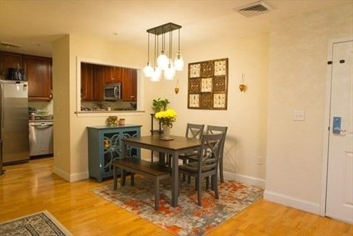 Dining room, Interior, Kitchen, Pendant Lights, Recessed Lighting, Stainless Steel Appliances, Wood Texture Flooring