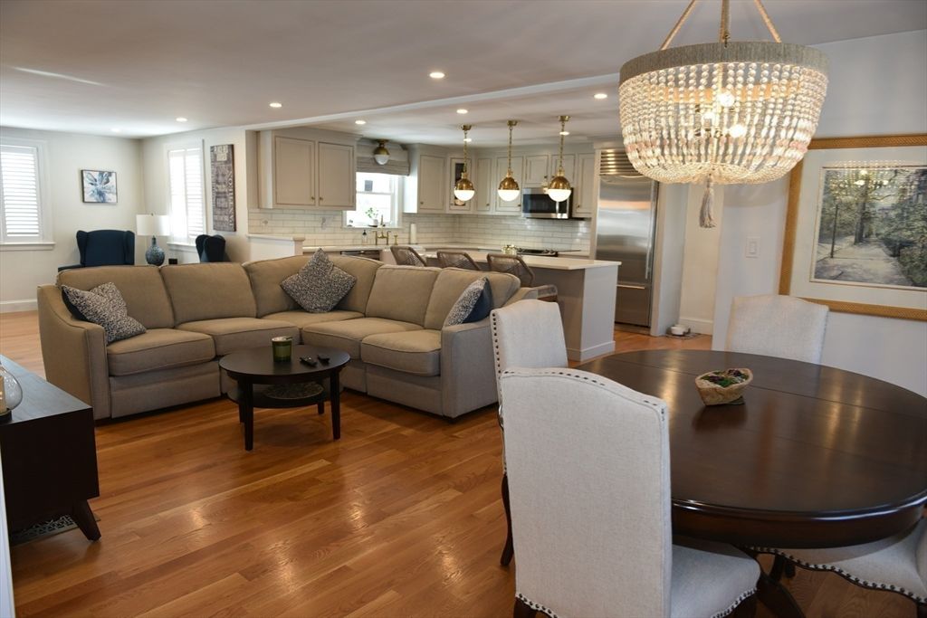 Chandelier, Dining room, Interior, Kitchen, Living room, Pendant Lights, Recessed Lighting, Stainless Steel Appliances, Wood Texture Flooring