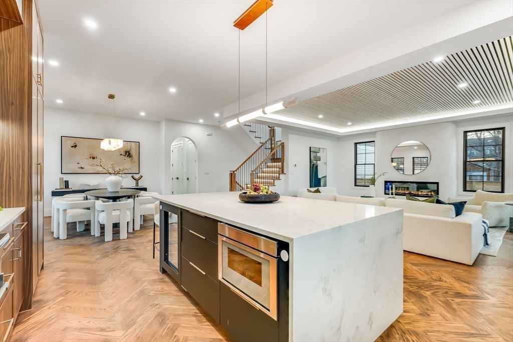 Dining room, Fireplace, Interior, Kitchen, Living room, Pendant Lights, Recessed Lighting, Stainless Steel Appliances, Wood Texture Flooring